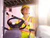 forklift driver working on a digital tablet at container shipyard