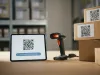 Qr code scanner and digital tablet displaying tracking information