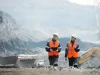 Workers with coal at open pit