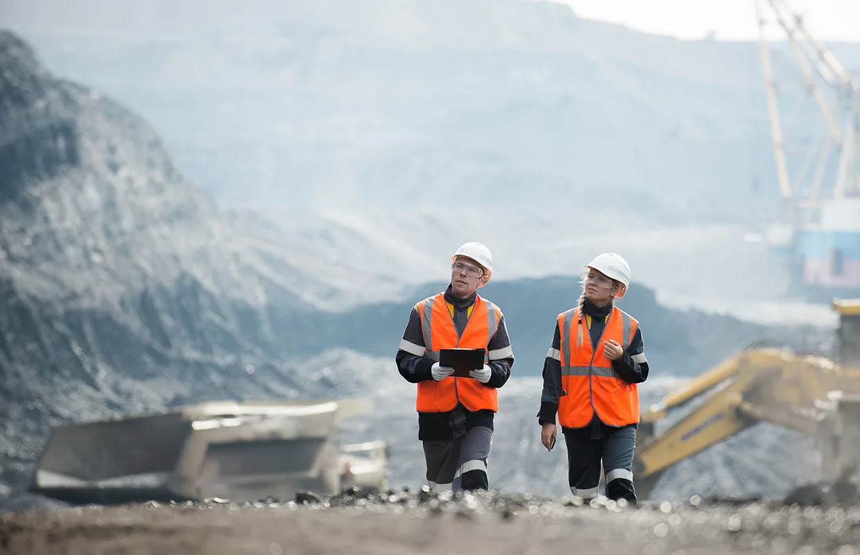 Workers with coal at open pit